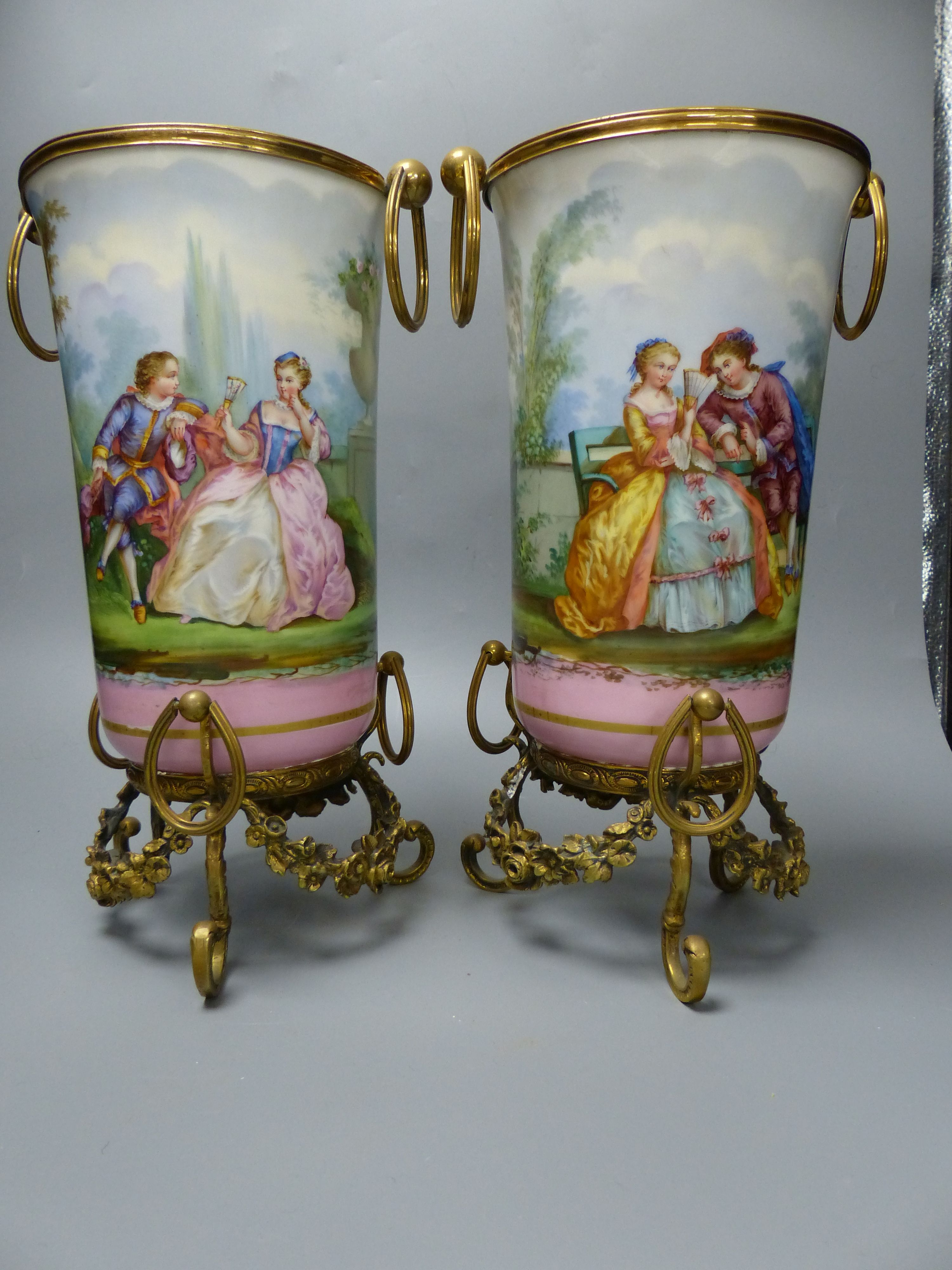 A pair of late 19th century Paris porcelain and gilt metal mounted vases, height 33cm